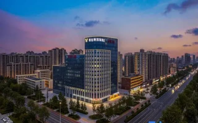 Vienna International Hotel (Heze Shan Development Zone Shunshi Building)