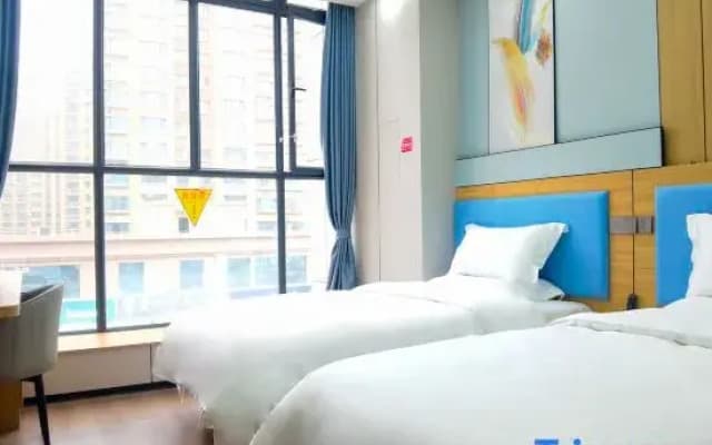 Rui Bai Yun Hotel (Xiaoyalang Wetland Park Branch) under the Home Inn