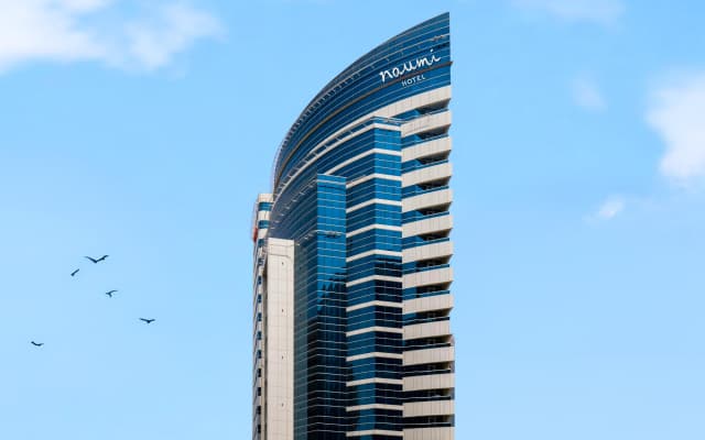 Отель Naumi Dubai