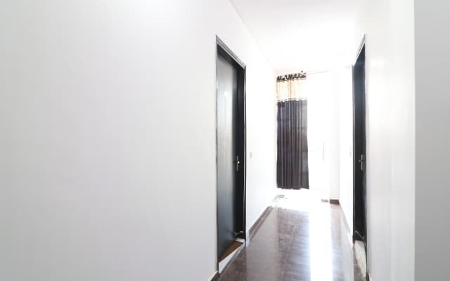 Red Carmine by OYO Rooms