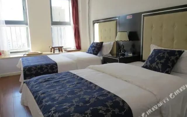 Guan County Hong Pu Traders Hotel