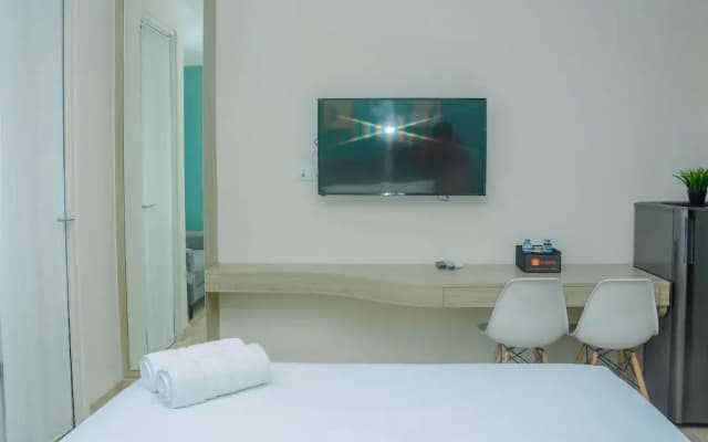 Fully Furnished and Comfortable Design Studio Menteng Park Apartment By Travelio