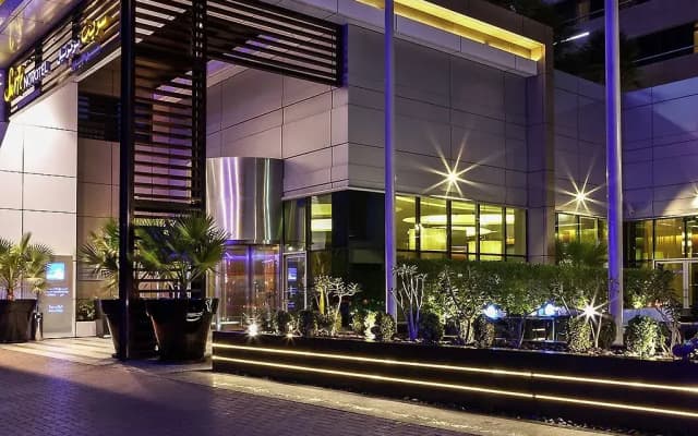 Отель Novotel Suites Mall Avenue Dubai