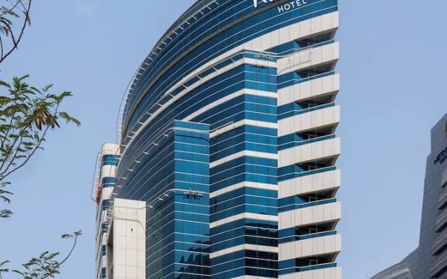 Отель Naumi Dubai