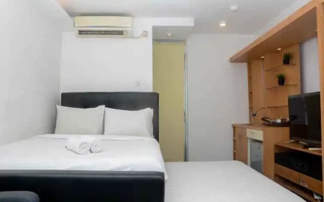 Fully Furnished with Cozy Design Studio Apartment at Bassura City By Travelio