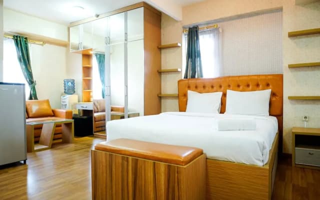 Furnished Studio with Comfortable Design Green Pramuka Apartment