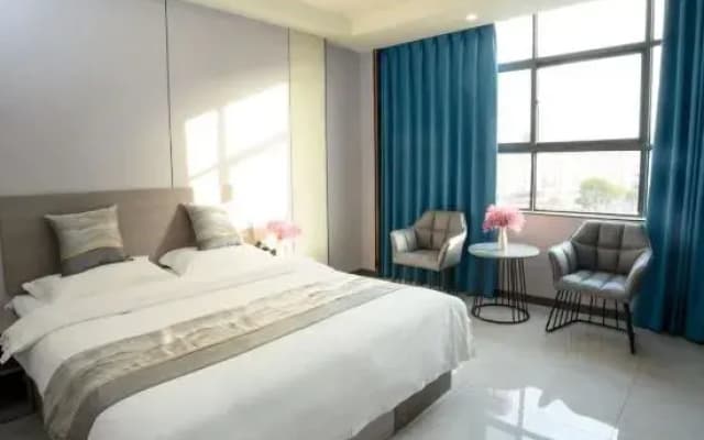 Pinxin Business Hotel (Gushi Experimental Middle School Chenyuanguang Plaza)